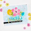 Greeting card with colorful flowers and text 'hello friend sending you hugs' on a textured background.