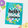 Turquoise card with floral designs and text on a white background